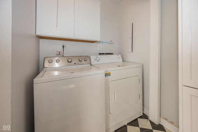 washroom featuring cabinet space and washing machine and dryer