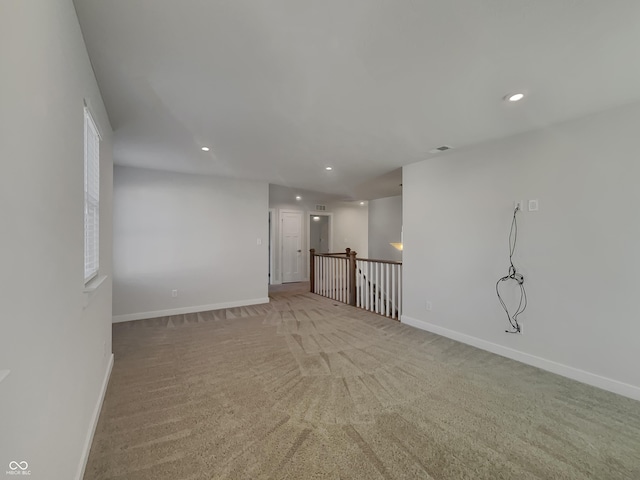 unfurnished room with recessed lighting, baseboards, and carpet flooring