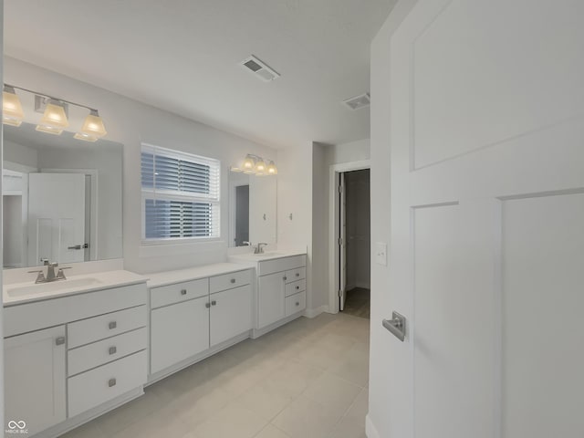 full bathroom with vanity and visible vents