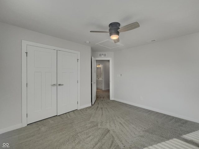 unfurnished bedroom featuring visible vents, light colored carpet, and baseboards