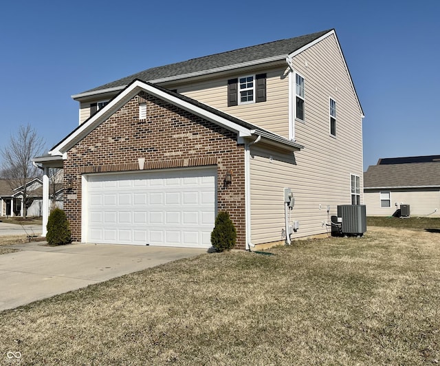 view of home's exterior with brick siding, central AC, a lawn, a garage, and driveway