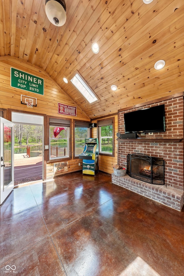 living area with wood walls, concrete floors, a brick fireplace, and wood ceiling
