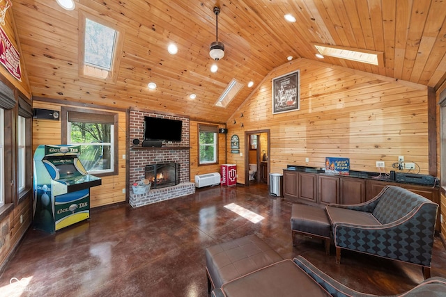 living room featuring a skylight, wood walls, and wooden ceiling