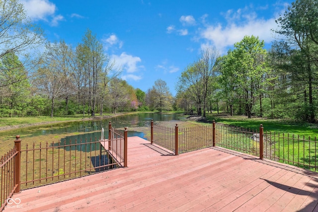 wooden deck featuring a water view