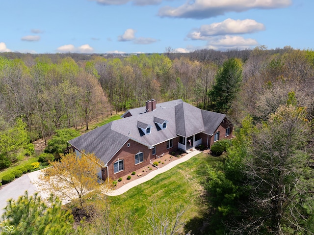 drone / aerial view with a view of trees