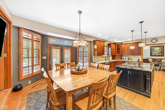 dining room with plenty of natural light, recessed lighting, and light wood-style floors