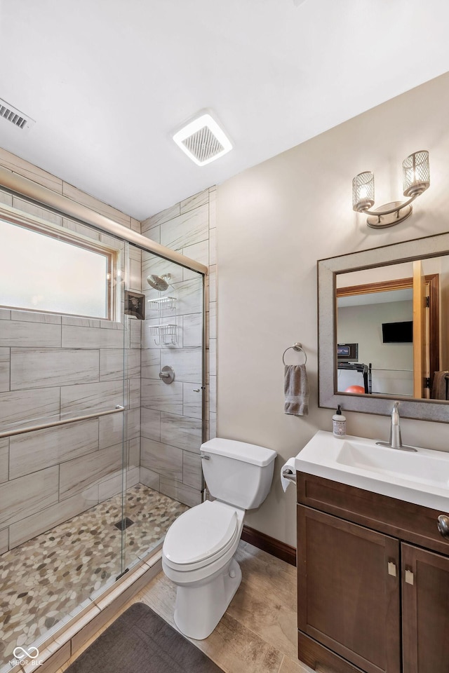 full bathroom with visible vents, a stall shower, and toilet