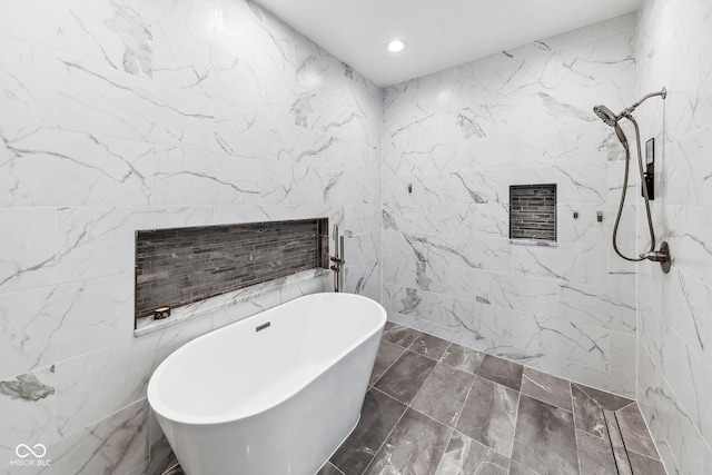 full bath featuring recessed lighting, tile walls, a tile shower, and a freestanding bath