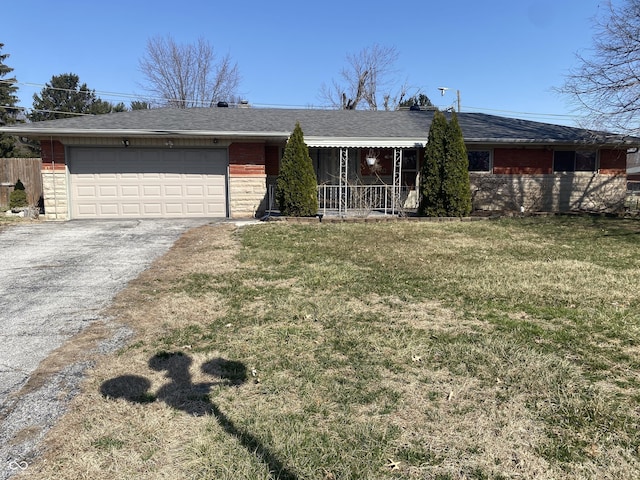 single story home featuring a porch, an attached garage, a shingled roof, a front lawn, and aphalt driveway