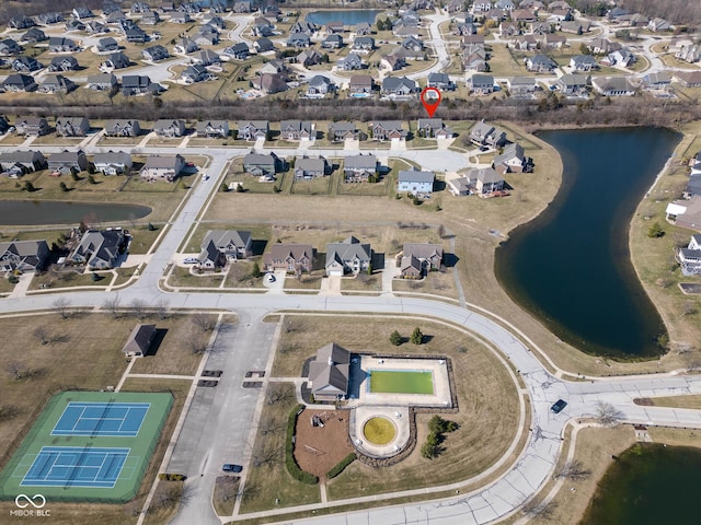 bird's eye view featuring a residential view and a water view