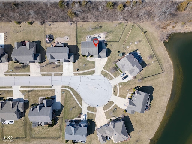 birds eye view of property with a residential view