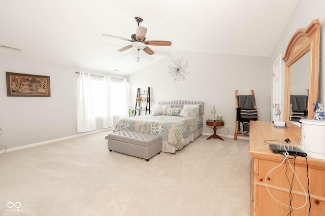 bedroom featuring visible vents, light carpet, baseboards, ceiling fan, and vaulted ceiling