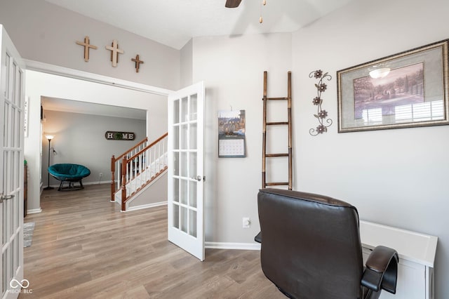 home office with ceiling fan, french doors, light wood-type flooring, and baseboards