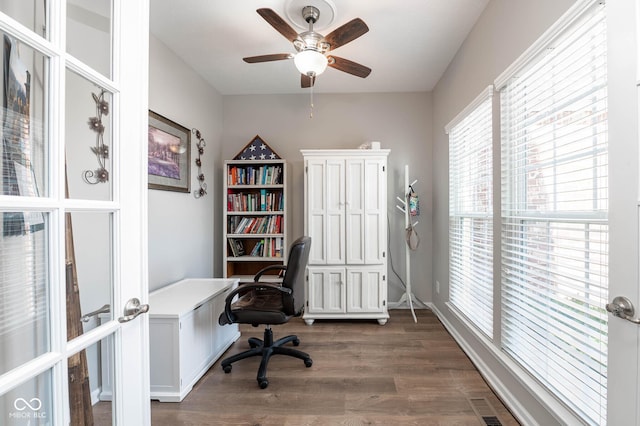 home office featuring dark wood-style floors, visible vents, french doors, and ceiling fan