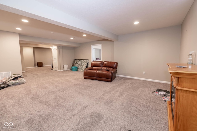 living area featuring carpet flooring, recessed lighting, and visible vents