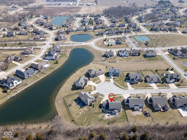 aerial view with a residential view and a water view