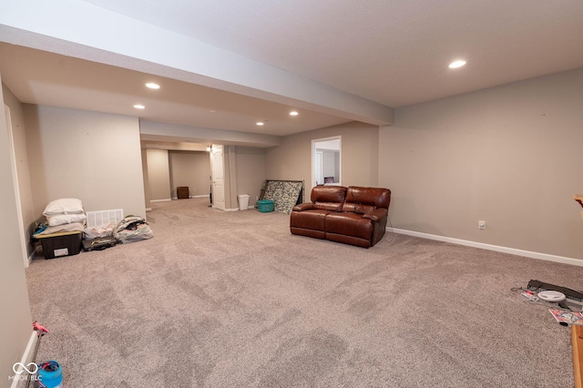 living area with recessed lighting, carpet, visible vents, and baseboards