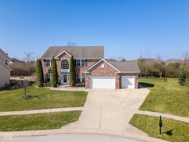 colonial home with a front yard, concrete driveway, brick siding, and a garage