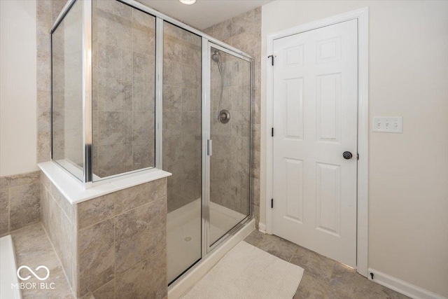 bathroom with a shower stall