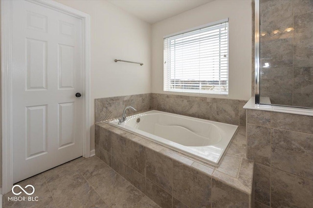 bathroom featuring a bath and tile patterned floors