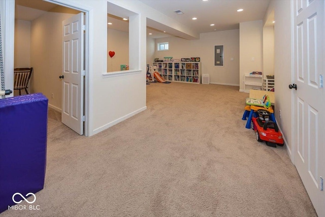 recreation room with electric panel, carpet flooring, recessed lighting, and baseboards