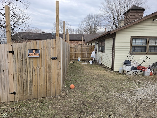 view of yard featuring a gate and fence