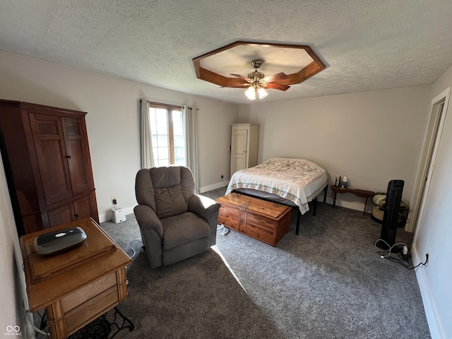 bedroom featuring baseboards, carpet floors, a textured ceiling, and ceiling fan