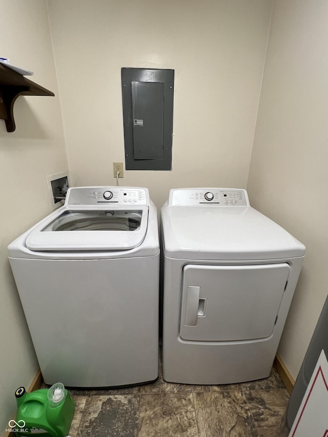 laundry area featuring electric panel, laundry area, and washing machine and clothes dryer