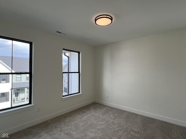457 Mariposa Trl, Carmel, IN 46032 - spare room with baseboards and carpet floors