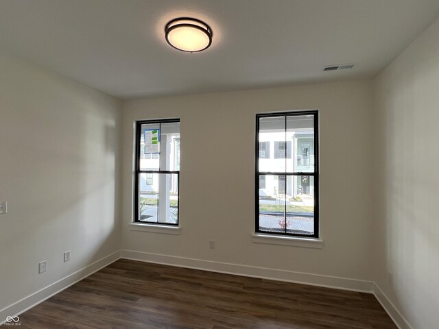 457 Mariposa Trl, Carmel, IN 46032 - unfurnished room featuring dark wood finished floors and baseboards