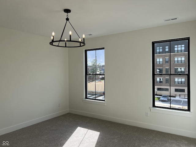 457 Mariposa Trl, Carmel, IN 46032 - unfurnished dining area with a chandelier, carpet flooring, and baseboards