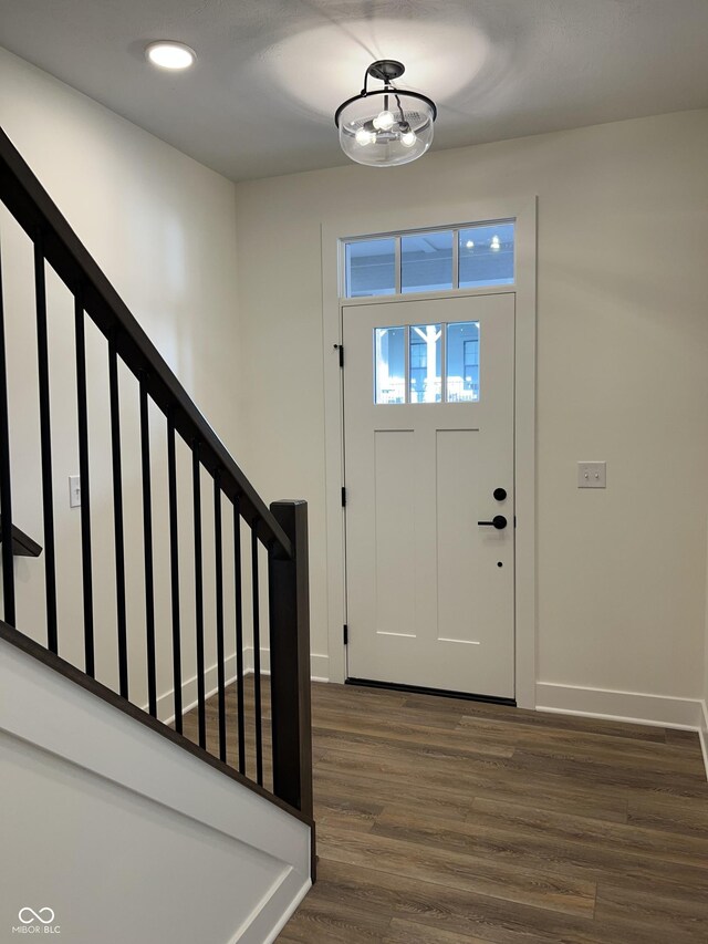 457 Mariposa Trl, Carmel, IN 46032 - entrance foyer with dark wood-style floors, stairway, baseboards, and recessed lighting