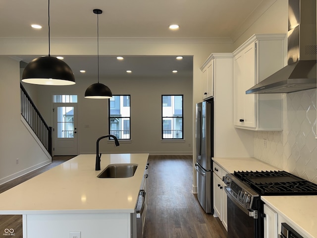 457 Mariposa Trl, Carmel, IN 46032 - kitchen with stainless steel appliances, wall chimney range hood, a sink, dark wood-type flooring, and white cabinetry