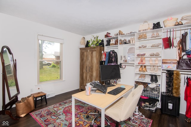 office space with wood finished floors and baseboards