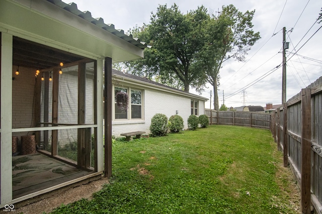 view of yard with a fenced backyard