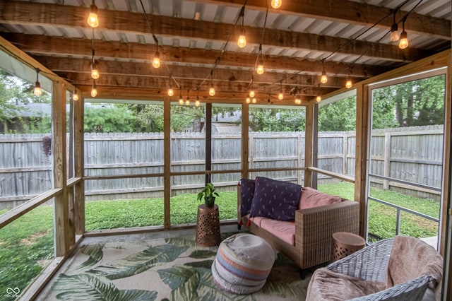 sunroom with beamed ceiling