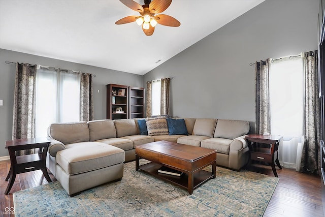 living room with high vaulted ceiling, baseboards, a ceiling fan, and wood-type flooring