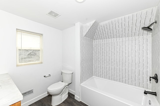 bathroom featuring bathtub / shower combination, toilet, wood finished floors, and visible vents