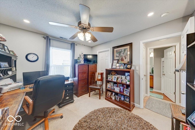 office area with visible vents, recessed lighting, ceiling fan, a textured ceiling, and light carpet