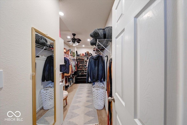 spacious closet featuring ceiling fan