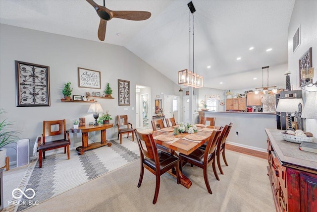 dining room featuring recessed lighting, visible vents, lofted ceiling, and ceiling fan with notable chandelier