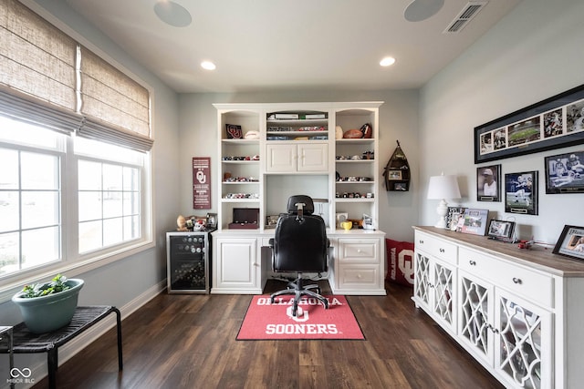 office area featuring dark wood-style floors, beverage cooler, visible vents, baseboards, and recessed lighting