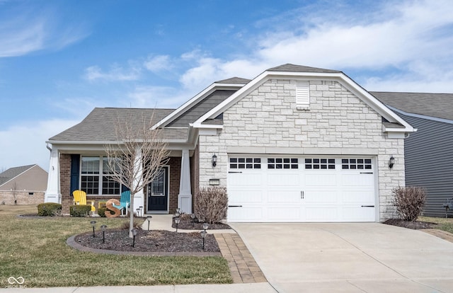 view of front facade with an attached garage, stone siding, driveway, and roof with shingles