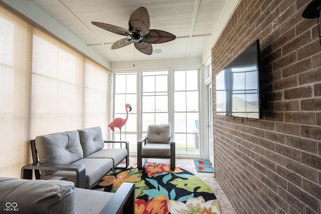 sunroom with a ceiling fan