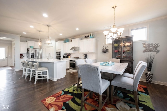 dining room featuring baseboards, recessed lighting, dark wood-style flooring, ornamental molding, and a chandelier