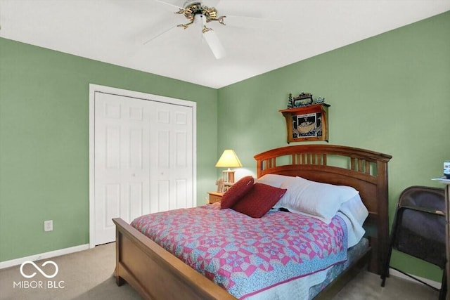 carpeted bedroom featuring a closet, baseboards, and ceiling fan