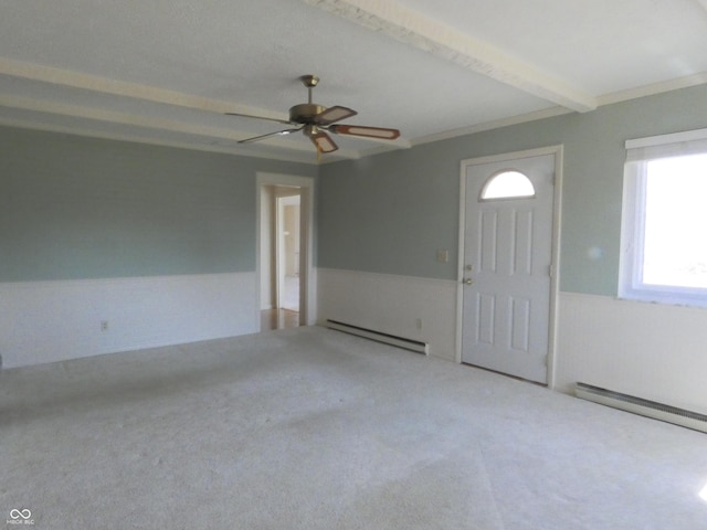 unfurnished room featuring a ceiling fan, a baseboard radiator, beamed ceiling, carpet flooring, and baseboard heating