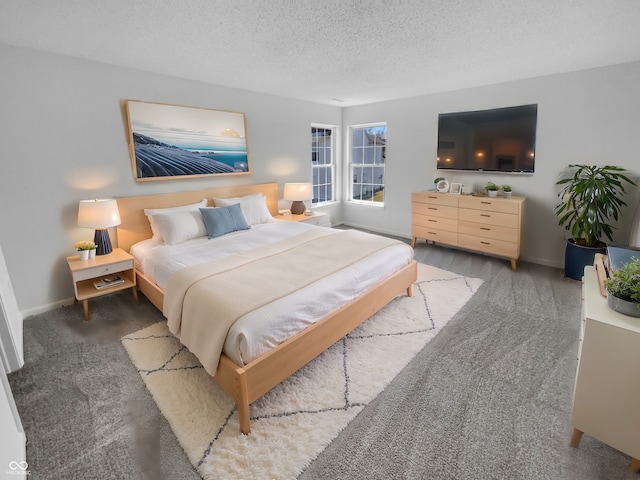 carpeted bedroom with baseboards and a textured ceiling