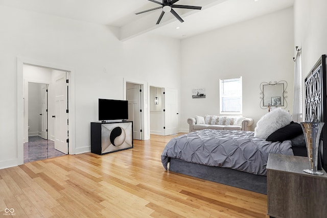 1209 N Rural St, Indianapolis, IN 46201 - bedroom featuring beamed ceiling, baseboards, wood finished floors, and a towering ceiling