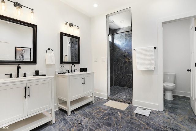 1209 N Rural St, Indianapolis, IN 46201 - bathroom featuring a tile shower, two vanities, baseboards, and a sink